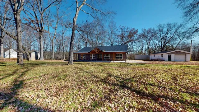 a house with trees in the background