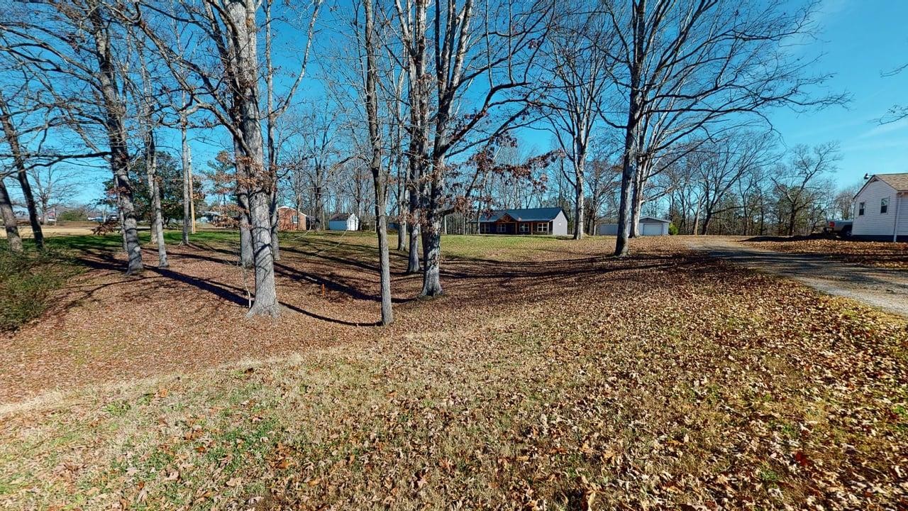 1490 Highway 100 Centerville, TN 37033 - Photo 26 of 28 a backyard of a house with lots of green space