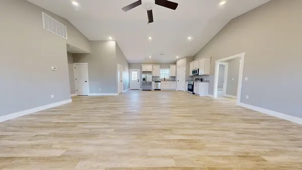 a view of a kitchen with a sink and cabinets