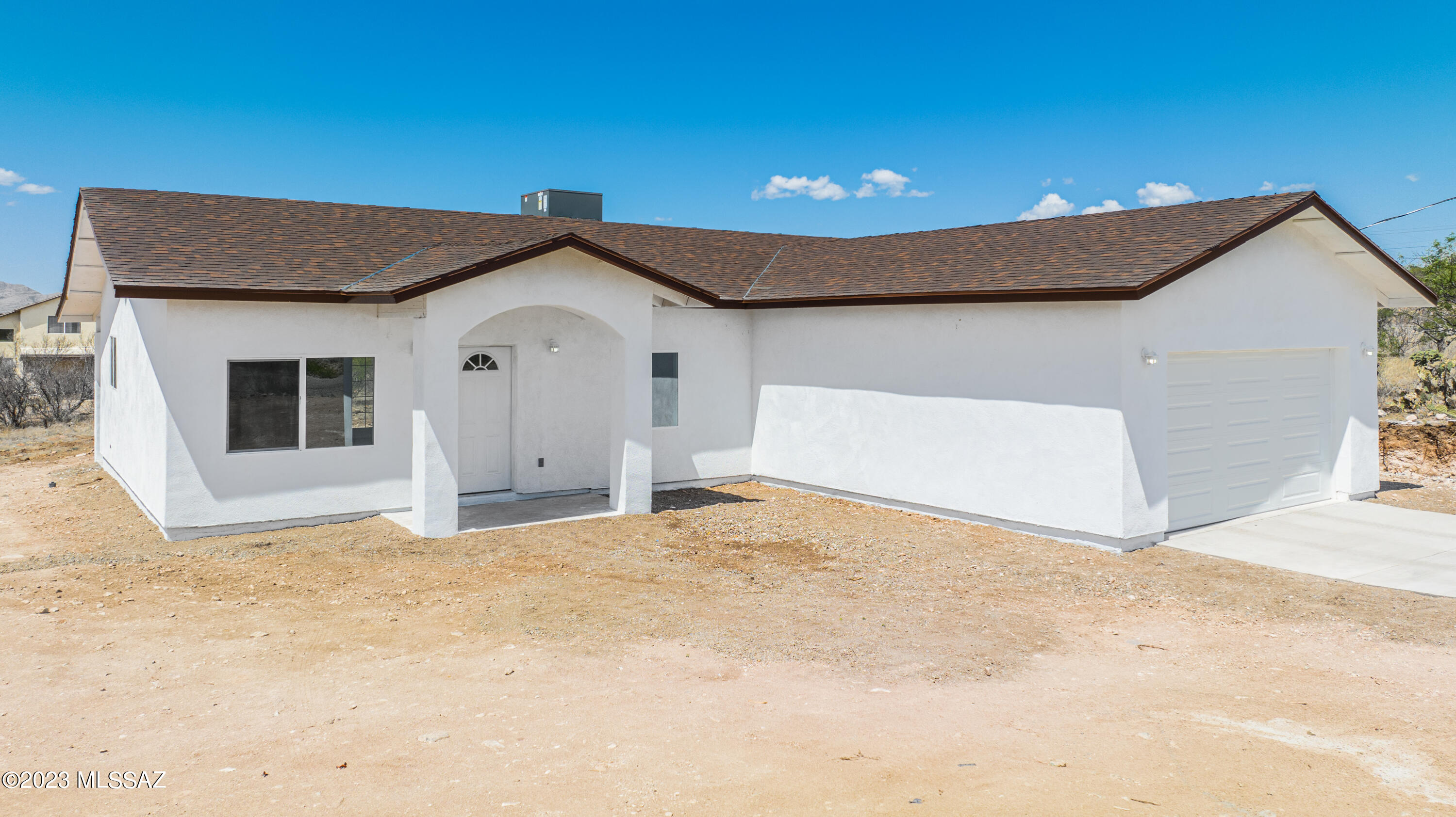 1846 Via Fontana Rio Rico, AZ 85648 - Photo 5 of 30 a view of a white house with a yard