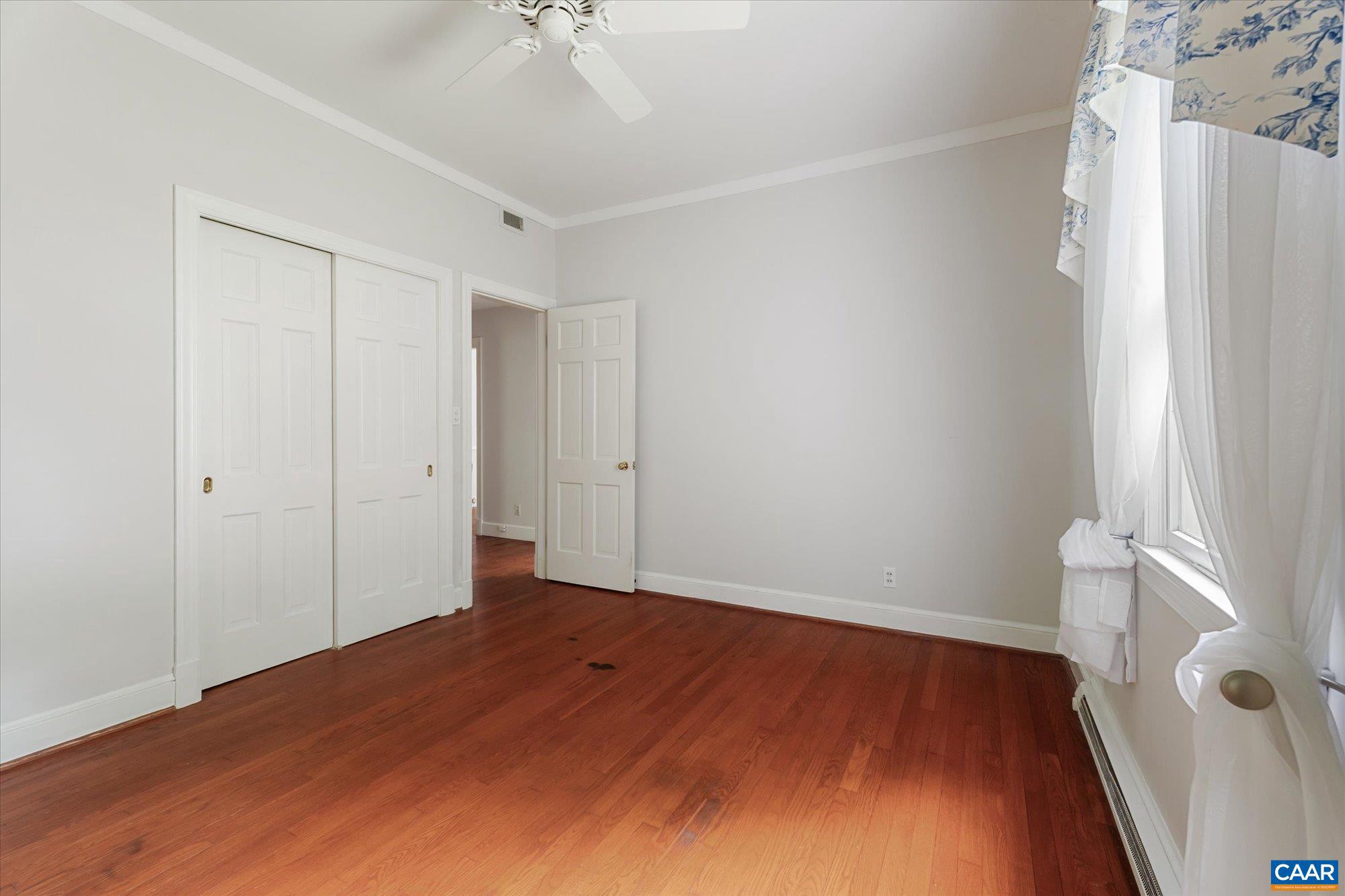 13320 Hackberry Road Orange, VA 22960 - Photo 23 of 47 a view of an empty room with wooden floor and a window
