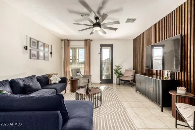 a living room with furniture and a large window