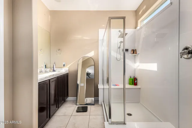 a bathroom with a shower and a sink