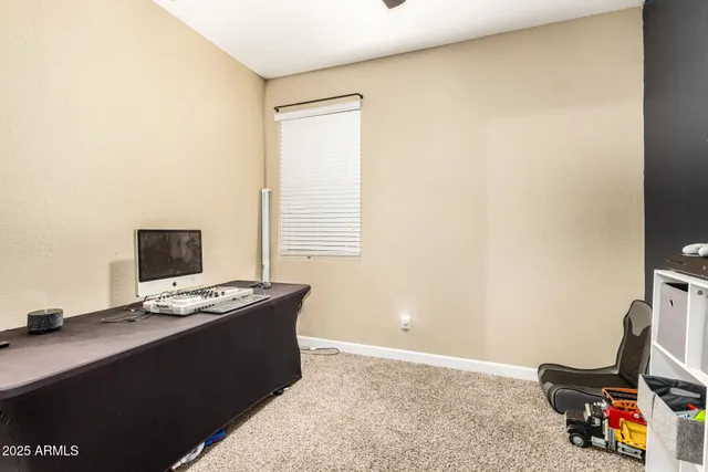 a laptop computer sitting on top of a desk