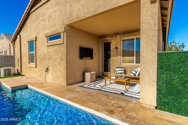 a backyard of a house with seating space