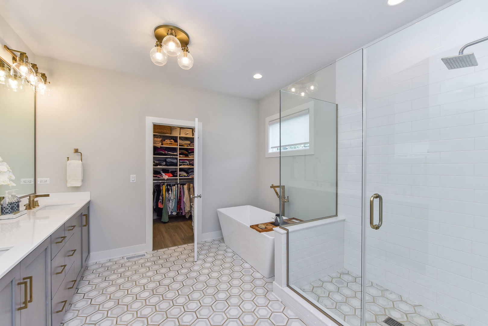 N337 Herrick Drive Wheaton, IL 60187 - Photo 21 of 37 a bathroom with a sink a toilet and a mirror