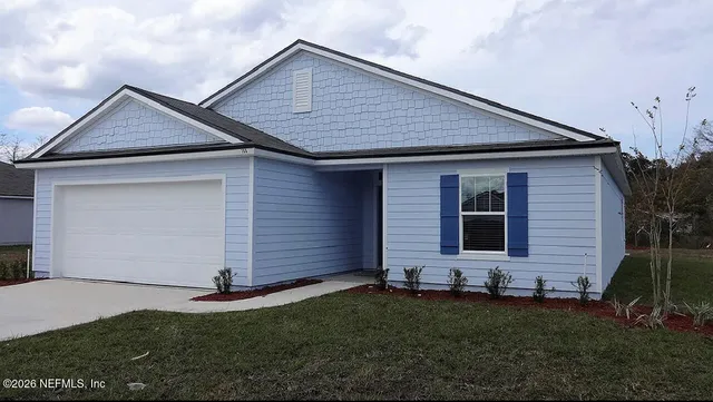 a front view of house with yard