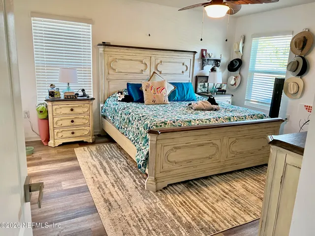 a bedroom with a bed and flat screen tv