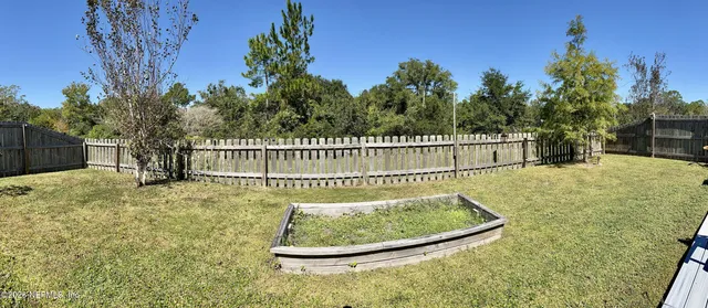 an aerial view of a house with a swimming pool