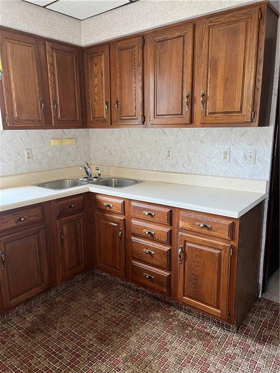 213 Card Avenue Wilmerding, PA 15148 - Photo 16 of 31 a kitchen with stainless steel appliances granite countertop a sink a stove and cabinets