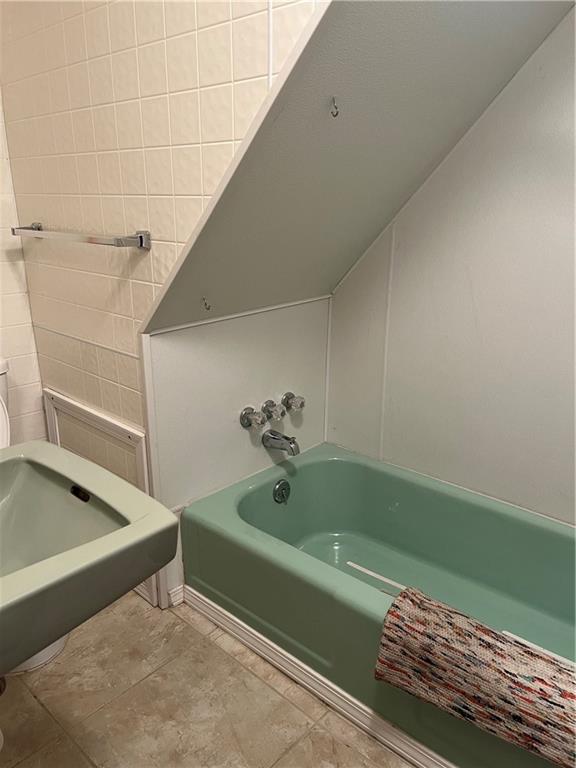 213 Card Avenue Wilmerding, PA 15148 - Photo 26 of 31 a bathroom with a tub and a shower