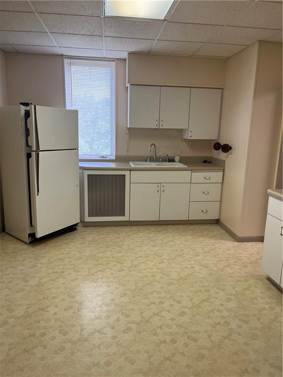 213 Card Avenue Wilmerding, PA 15148 - Photo 7 of 31 a room with a refrigerator stove and white cabinets