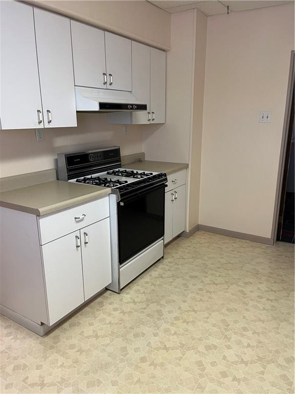 213 Card Avenue Wilmerding, PA 15148 - Photo 8 of 31 a kitchen with white cabinets and white appliances