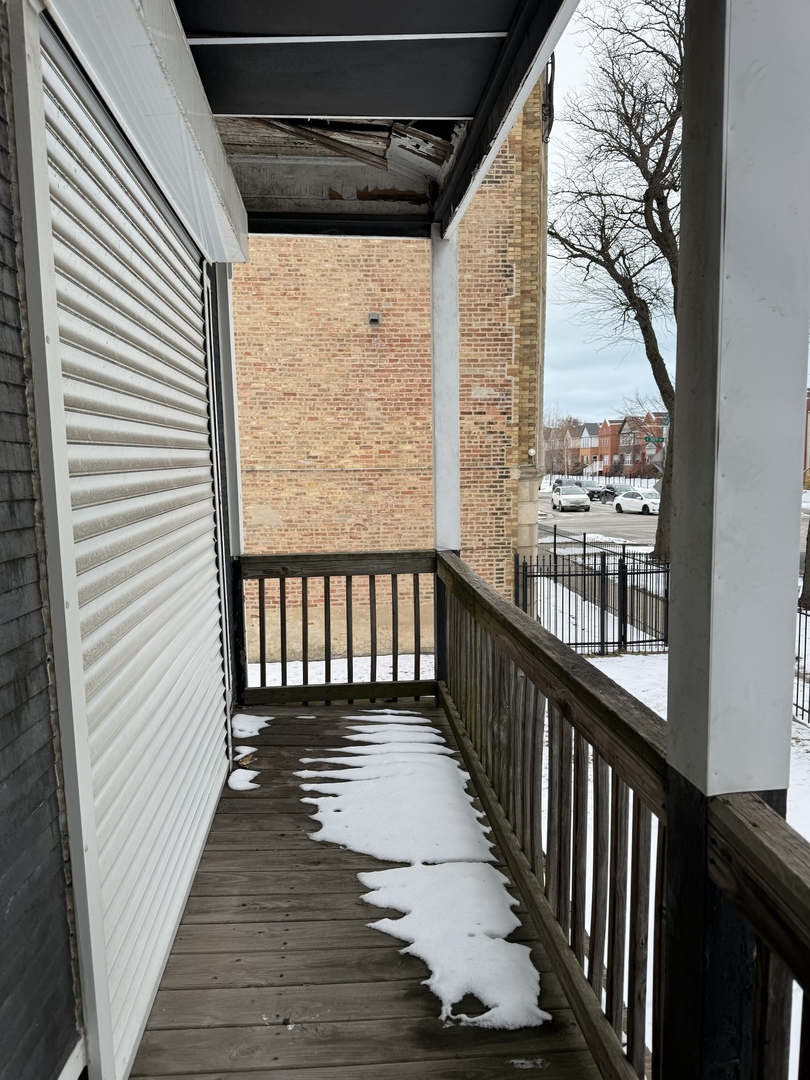 7006 South East End Avenue Chicago, IL 60649 - Photo 2 of 26 a view of a balcony with wooden floor