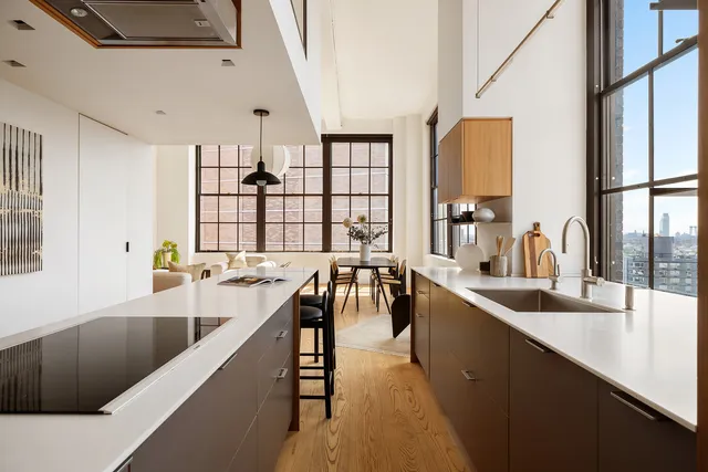 a living room with furniture a rug and a flat screen tv
