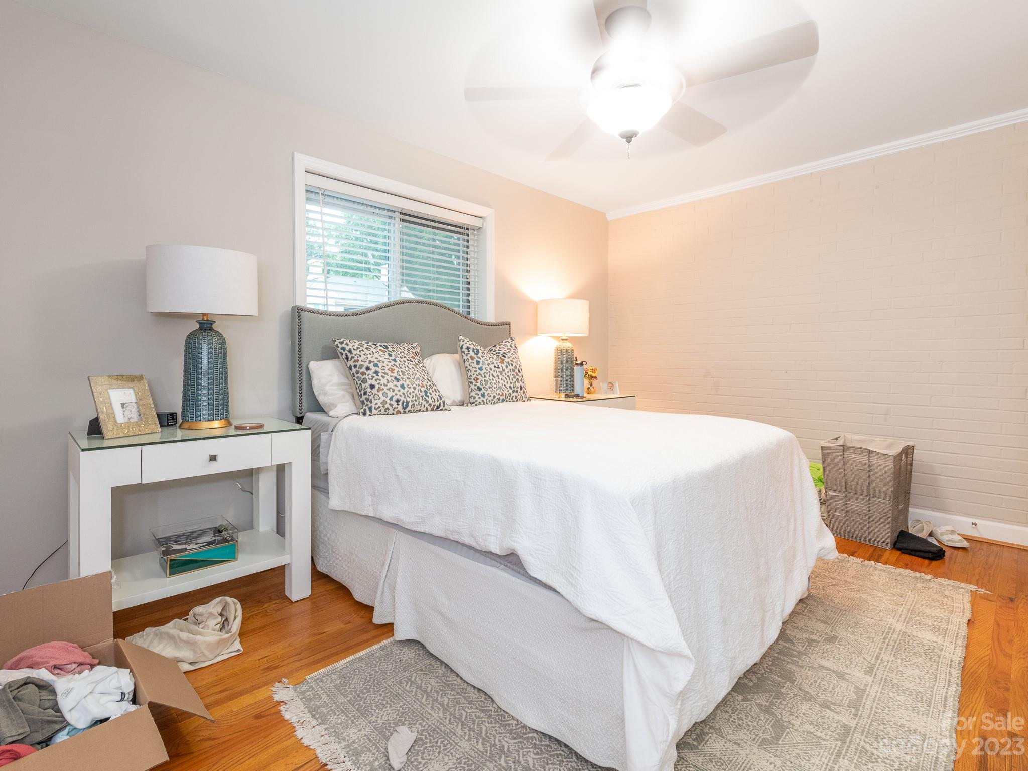 400 Queens Road, Unit C6 Charlotte, NC 28207 - Photo 17 of 25 a bedroom with a bed and a fireplace