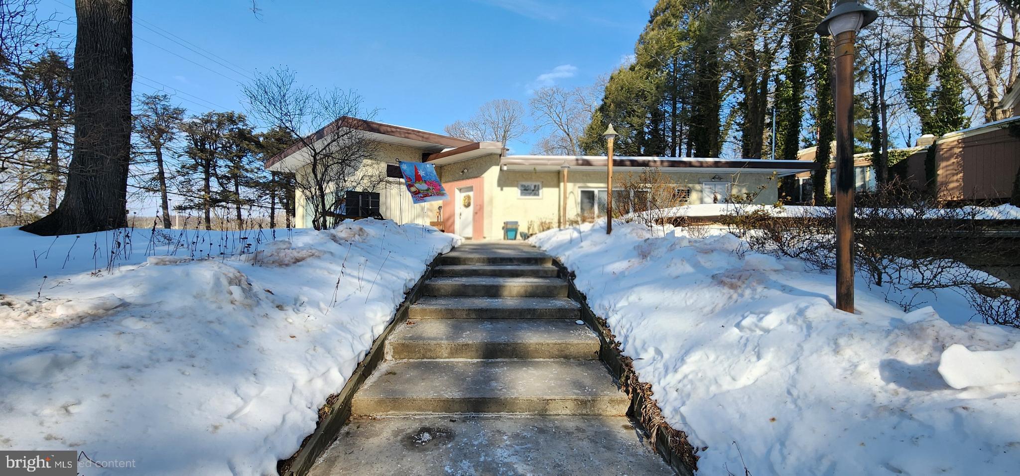 587 Moreland Road Huntingdon Valley, PA 19006 - Photo 19 of 20 Charming home nestled in a winter landscape.