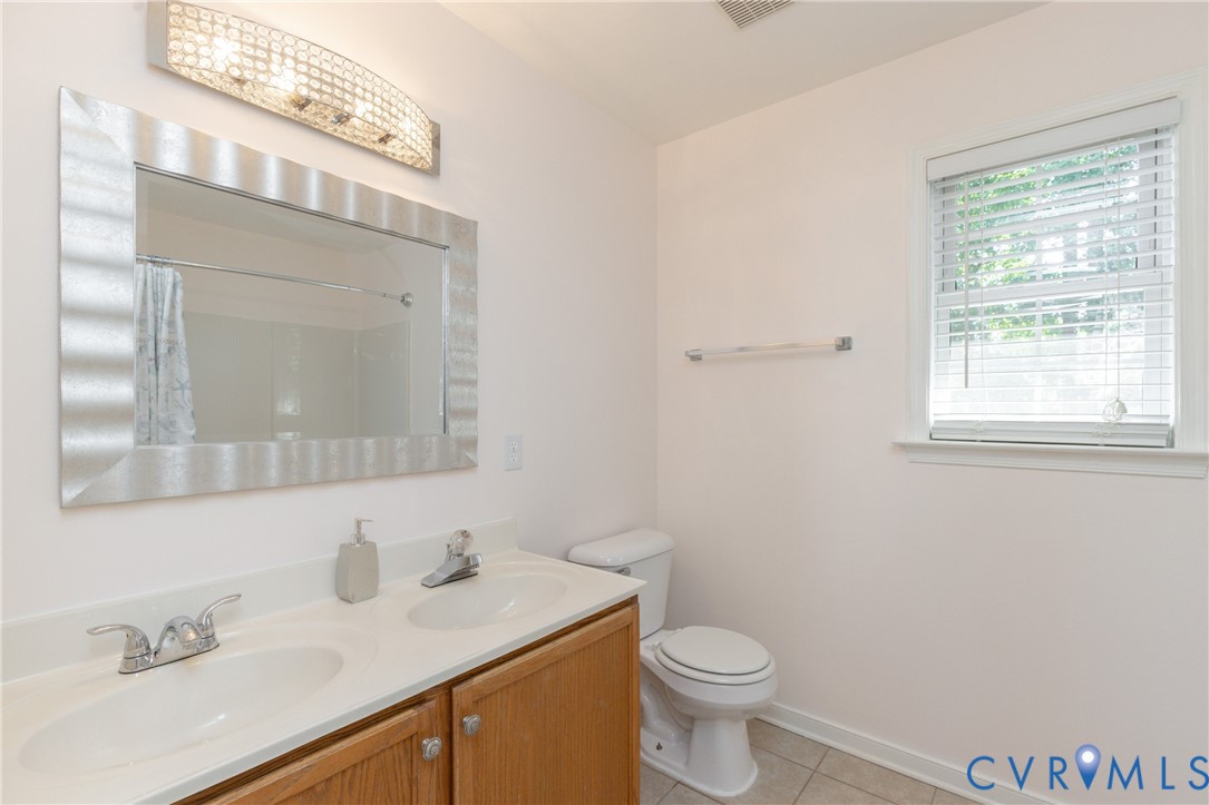 5101 Spring Bluff Road Midlothian, VA 23112 - Photo 31 of 47 Dual sink vanity with wood-finish cabinetry, chrom