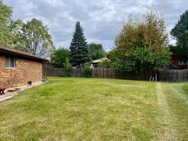 a backyard of a house with lots of green space