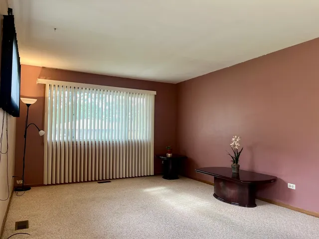a view of a livingroom with a staircase