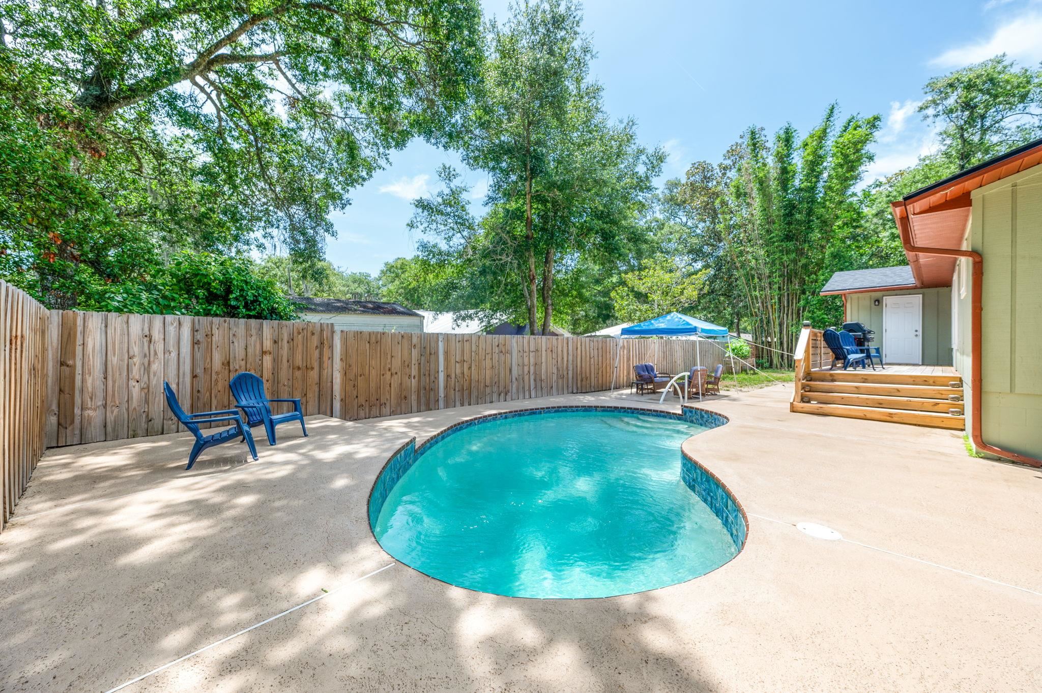 507 Gentian Road St. Augustine, FL 32086 - Photo 40 of 82 a backyard of a house with table and chairs
