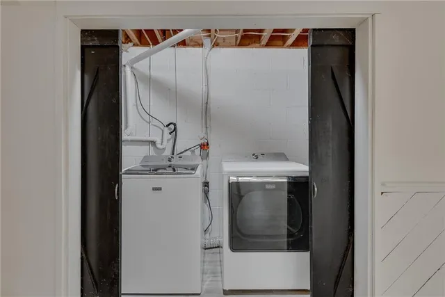 a utility room with dryer and washer