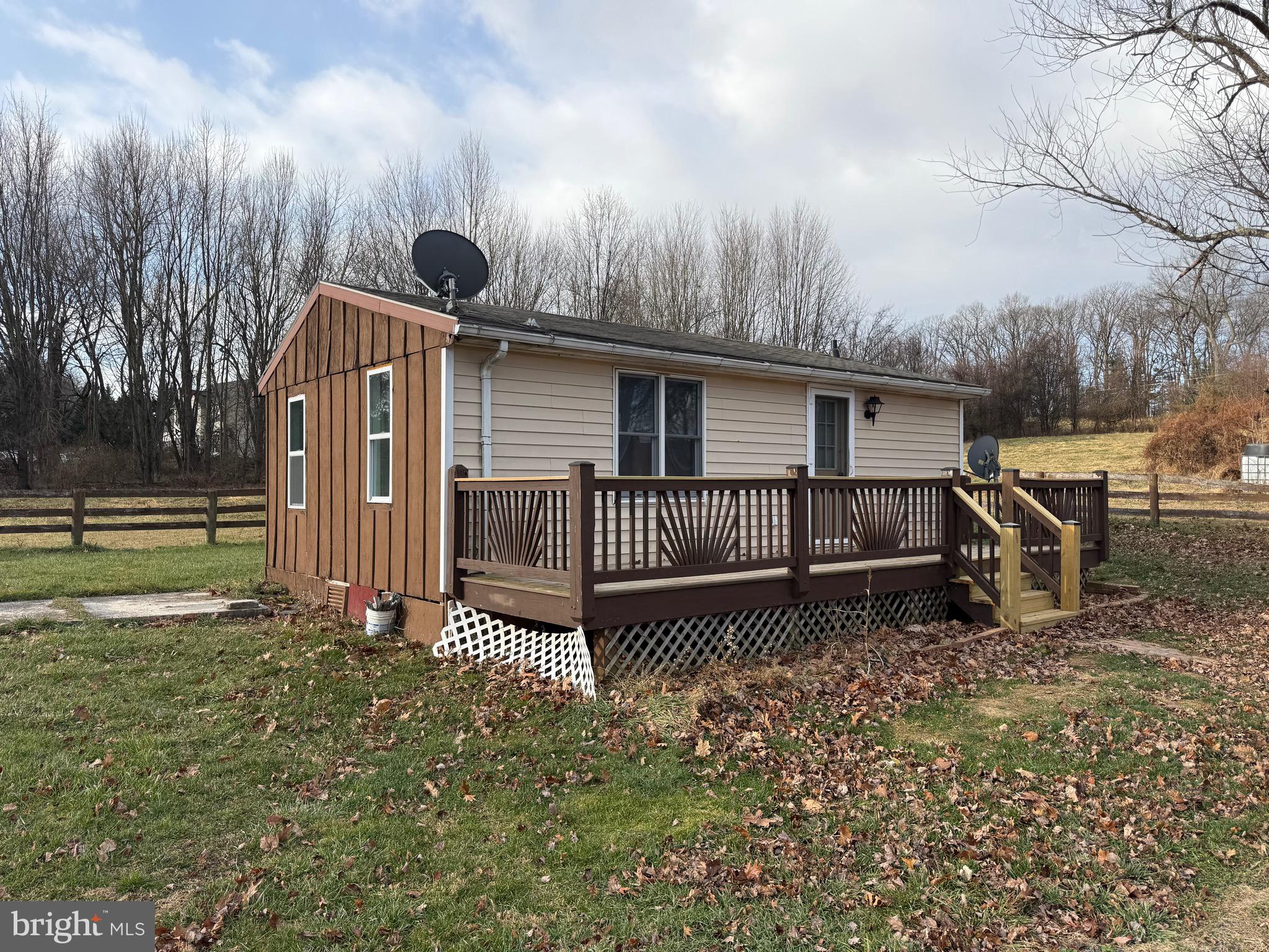 4047 Ridge Road Westminster, MD 21157 - Photo 21 of 33 a view of a house with a wooden fence