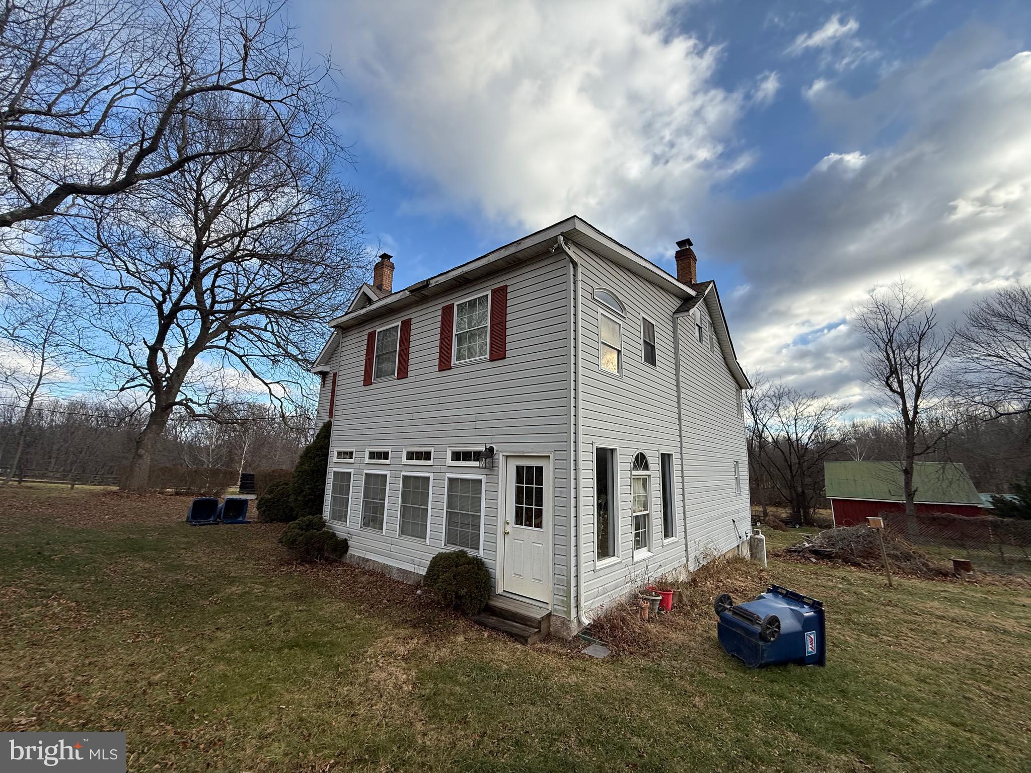4047 Ridge Road Westminster, MD 21157 - Photo 5 of 33 a front view of a house with a yard