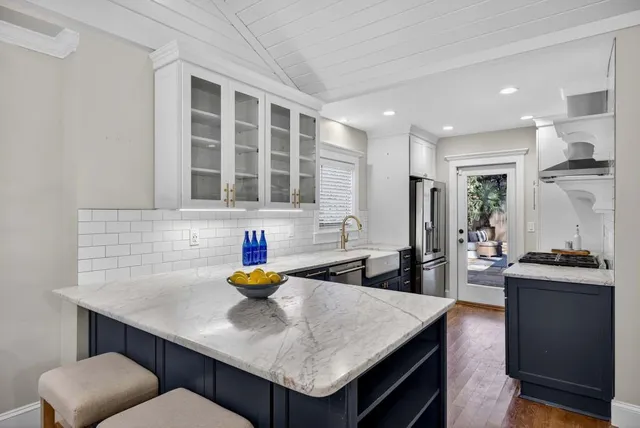 a kitchen with a stove and a refrigerator
