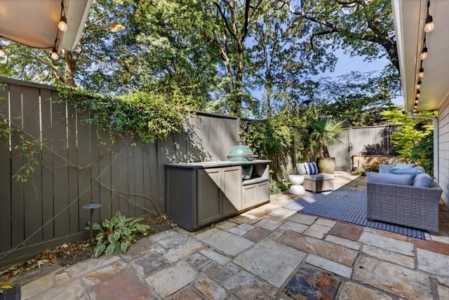 a view of a workspace with furniture and wooden floor