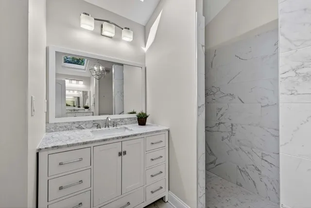 a view of a hallway with closet and utility room