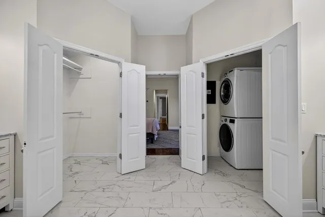 a bathroom with a bathtub shower sink mirror vanity and toilet