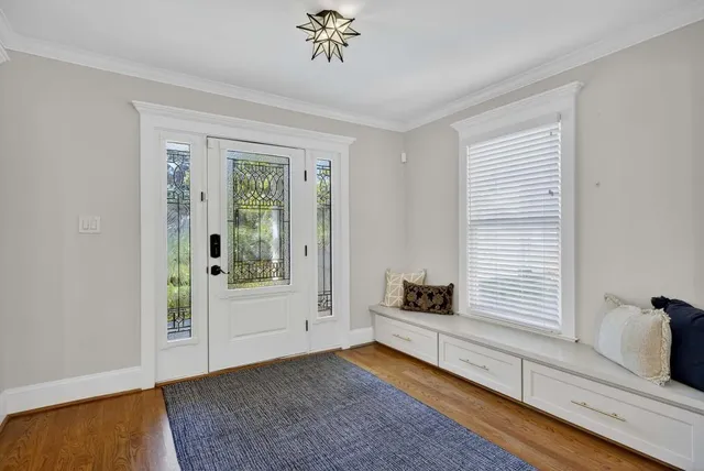 a living room with furniture and a rug