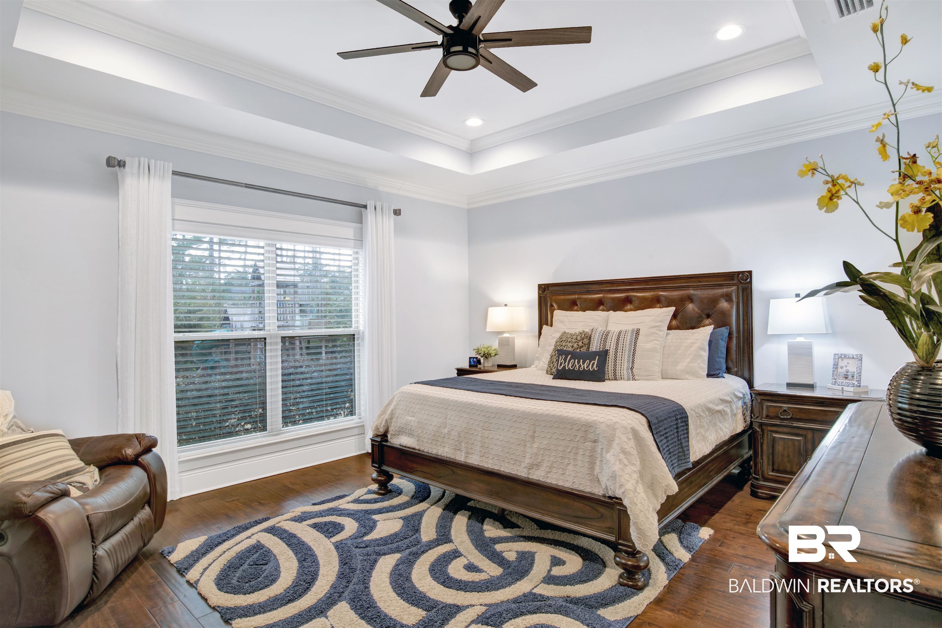 18360 Treasure Oaks Road Gulf Shores, AL 36542 - Photo 29 of 57 Bedroom with a raised ceiling, crown molding, dark hardwood / wood-style floors, and ceiling fan