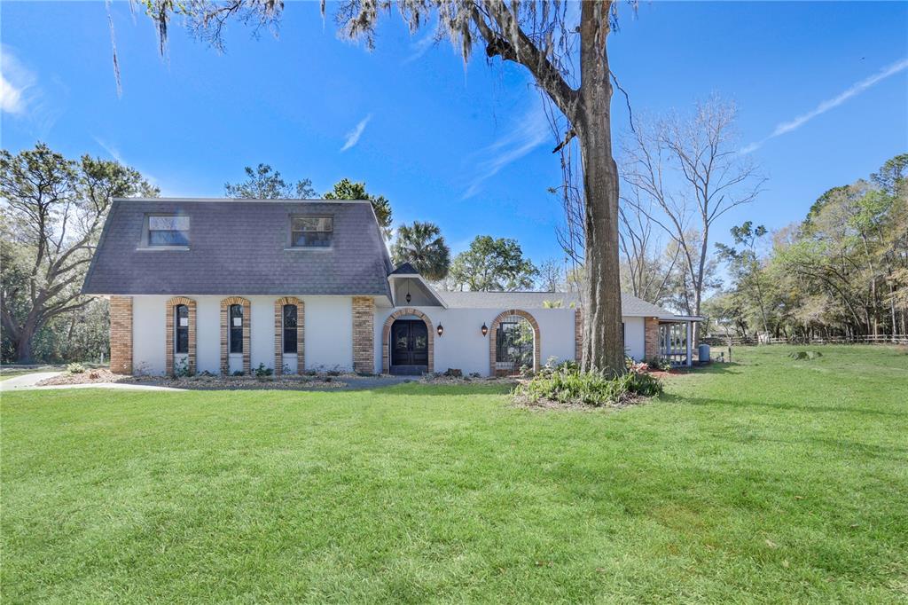 front view of a house with a yard