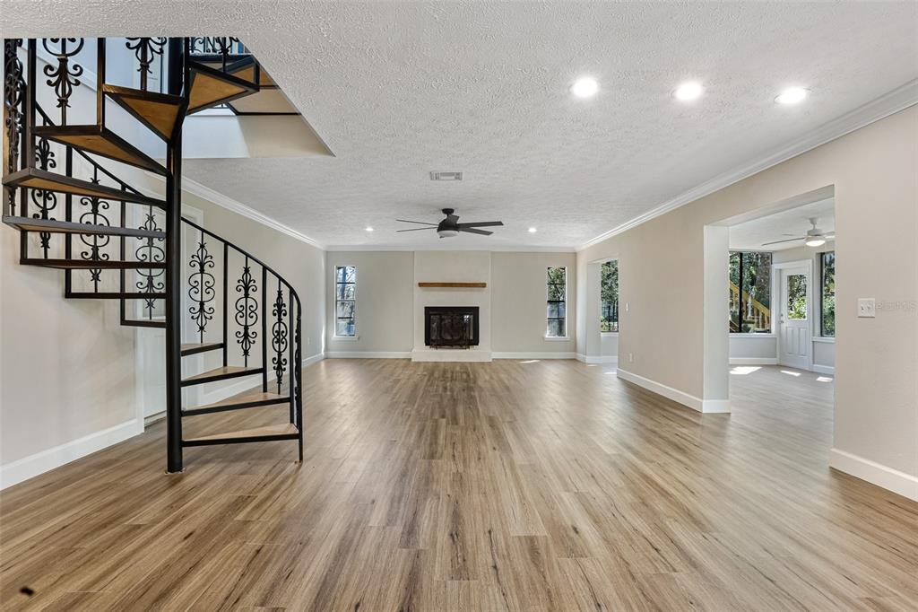 2830 Southeast 31st Street Ocala, FL 34471 - Photo 14 of 23 wooden floor in an empty room with a window