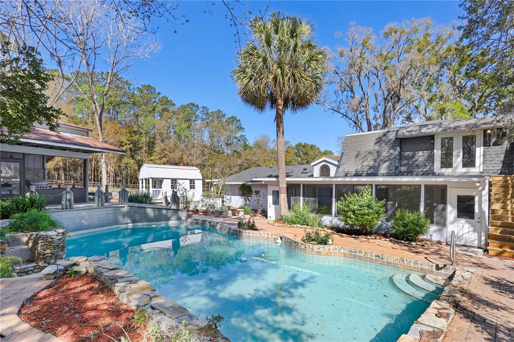 2830 Southeast 31st Street Ocala, FL 34471 - Photo 19 of 23 a front view of a house with garden