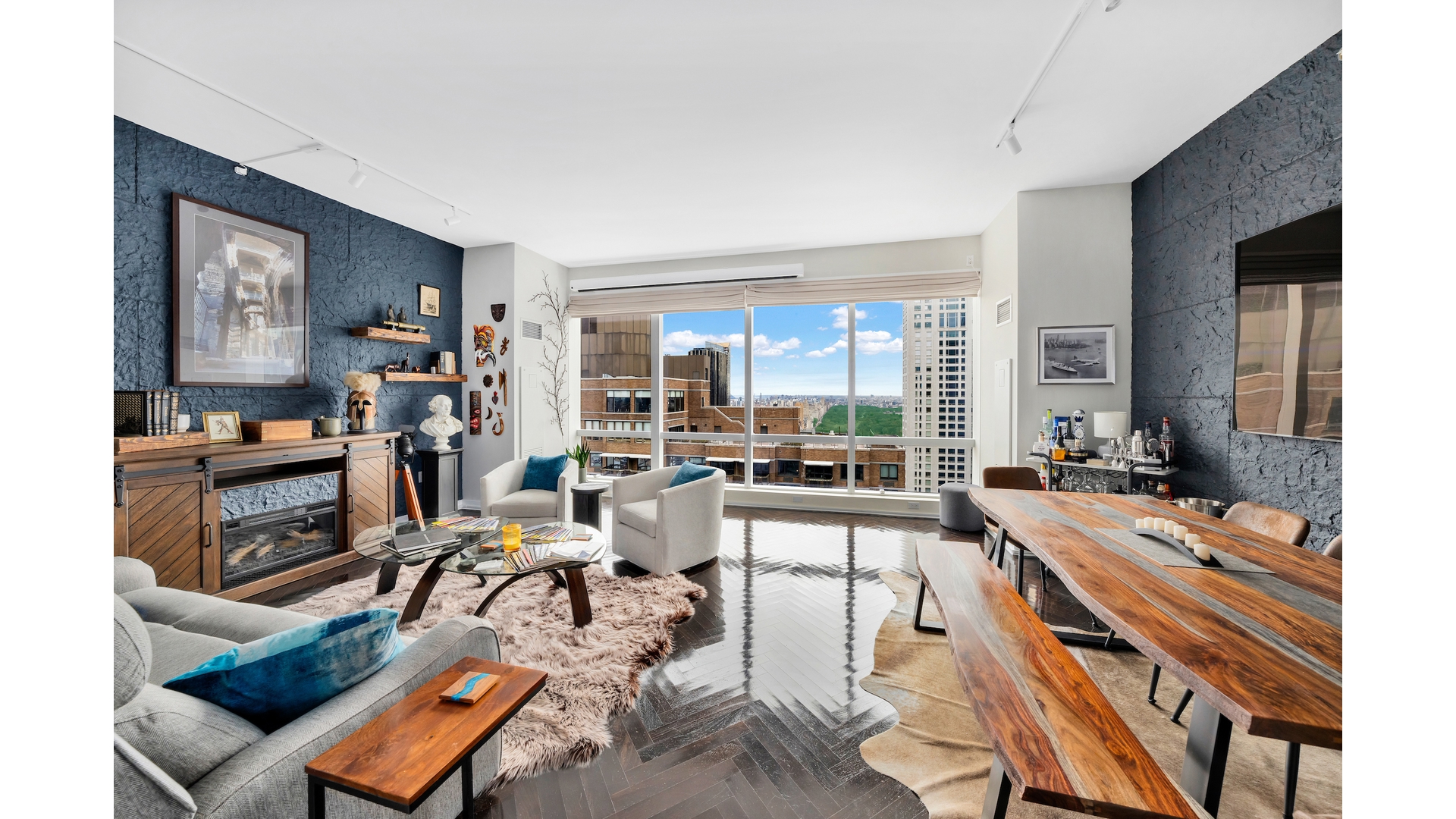 230 West 56th Street, Unit 54F Manhattan, NY 10019 - Photo 1 of 12 a room with lots of furniture and view of kitchen
