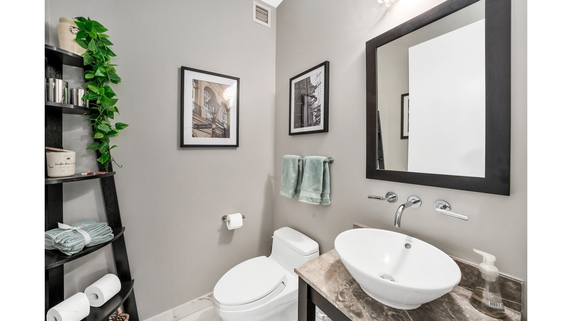 230 West 56th Street, Unit 54F Manhattan, NY 10019 - Photo 11 of 12 a bathroom with a toilet a sink and mirror