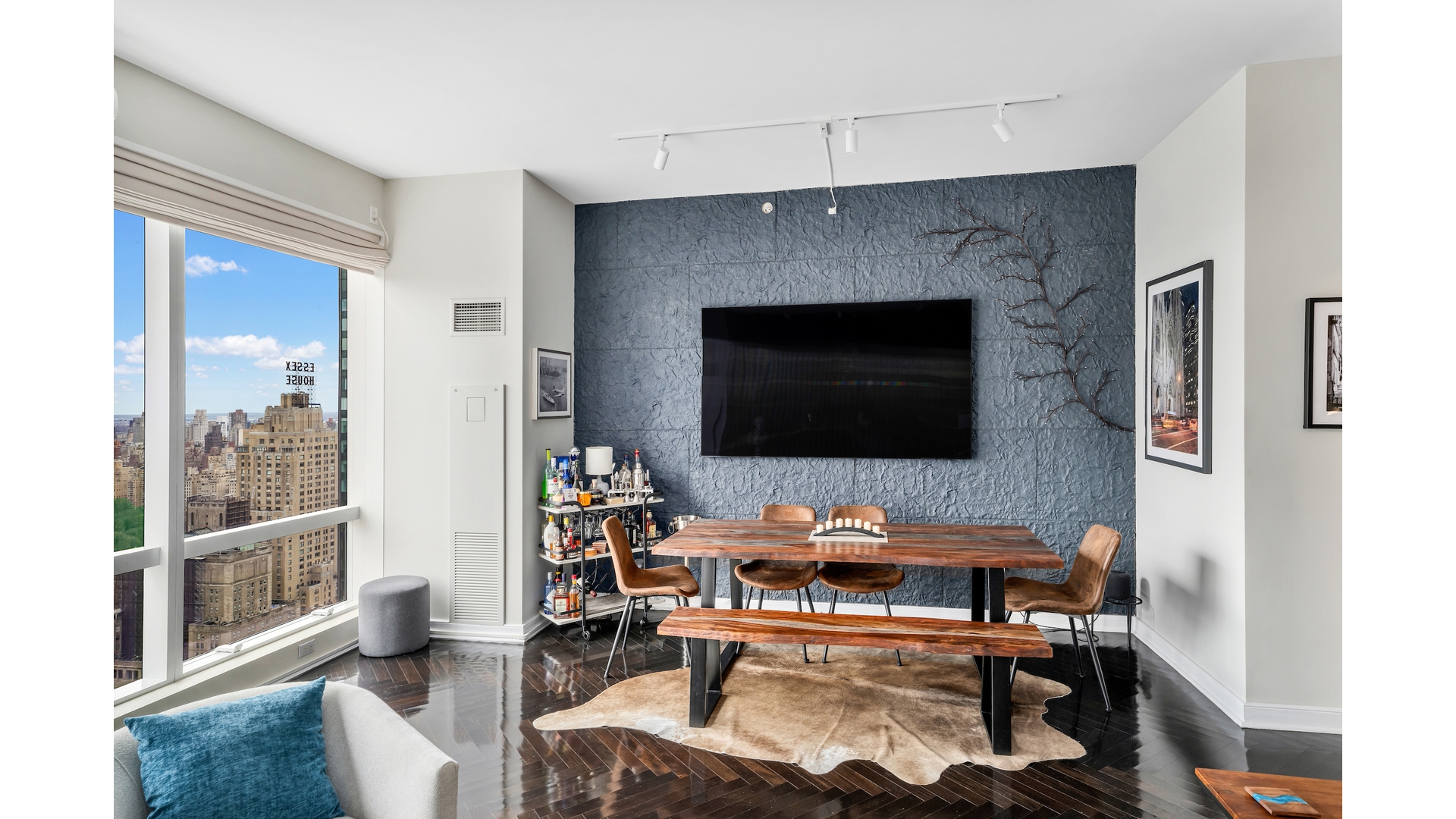 230 West 56th Street, Unit 54F Manhattan, NY 10019 - Photo 2 of 12 a living room with furniture and a fireplace