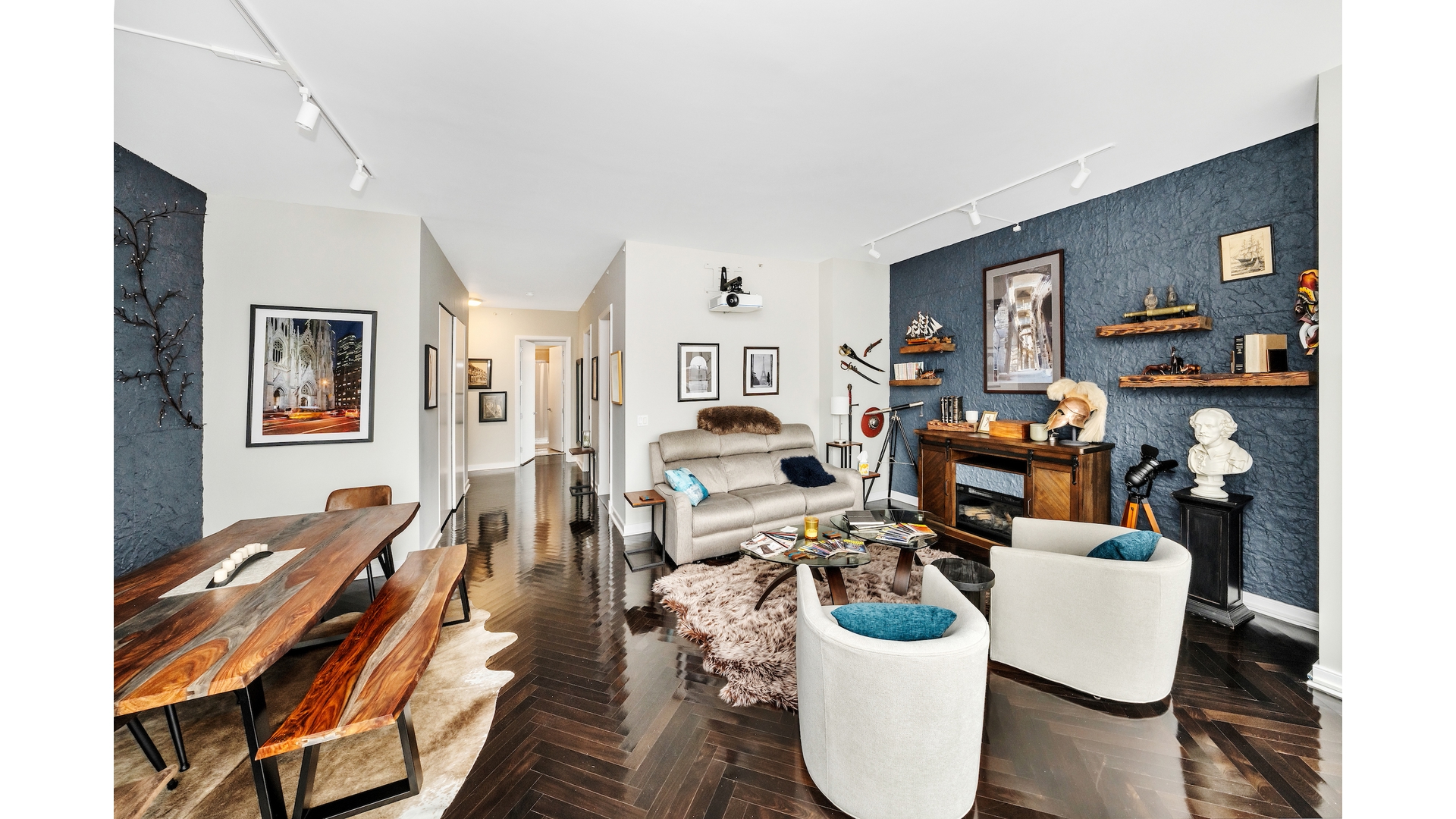 230 West 56th Street, Unit 54F Manhattan, NY 10019 - Photo 4 of 12 a living room with furniture and a wooden floor
