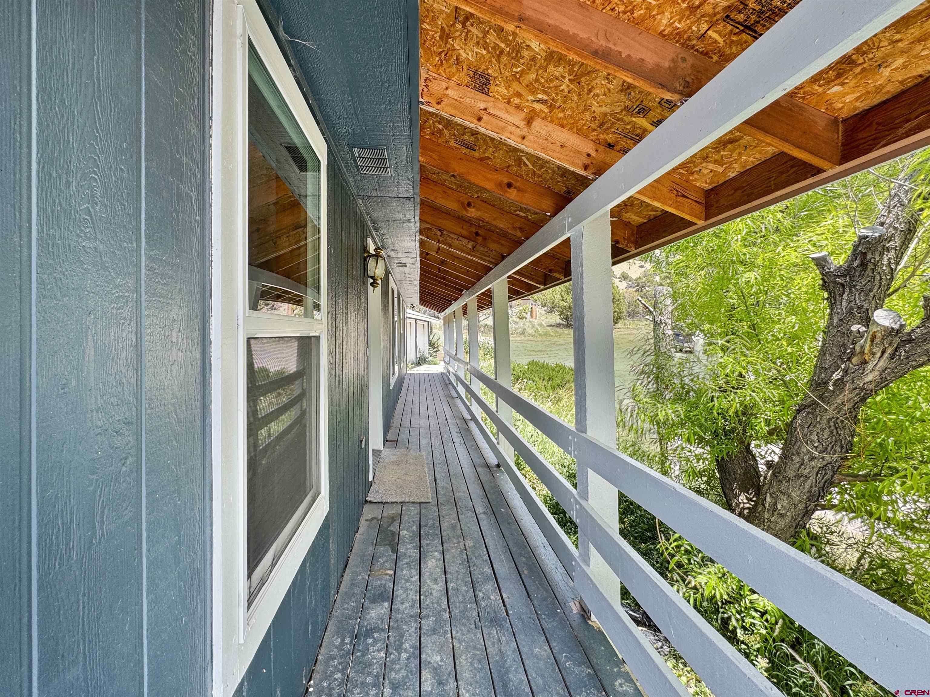43157 Long Gulch Road Crawford, CO 81415 - Photo 24 of 35 a view of balcony with wooden floor and fence