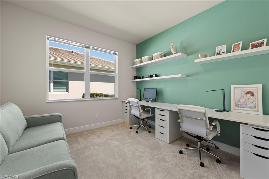 8897 Redonda Drive Naples, FL 34114 - Photo 25 of 42 a view of a workspace with furniture and a window