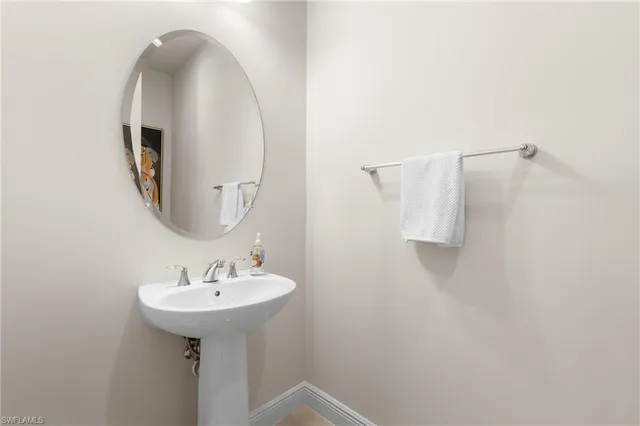 a view of storage and utility room with racks on the wall