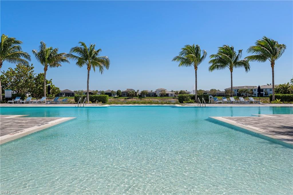 8897 Redonda Drive Naples, FL 34114 - Photo 29 of 42 a view of swimming pool and lake view