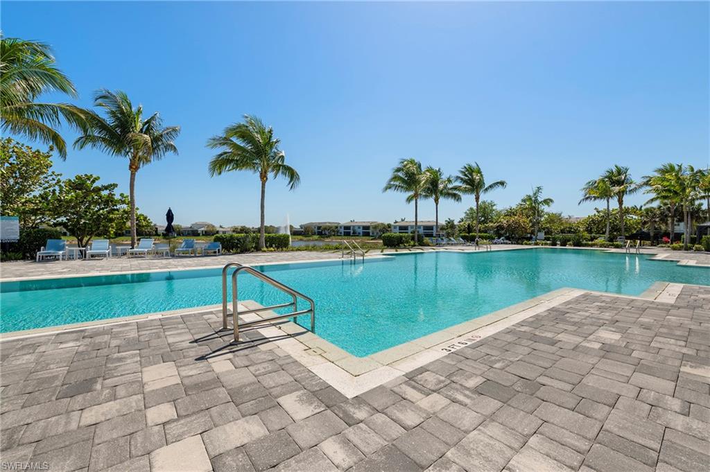 8897 Redonda Drive Naples, FL 34114 - Photo 30 of 42 a swimming pool with yard and lake view