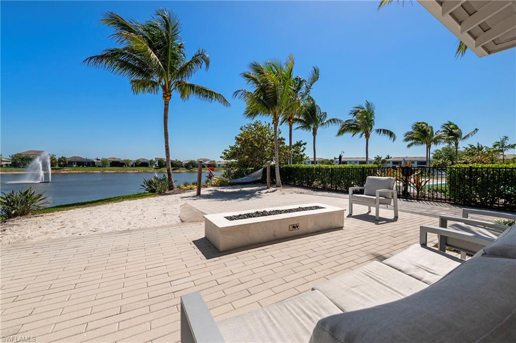 8897 Redonda Drive Naples, FL 34114 - Photo 32 of 42 a view of swimming pool with outdoor seating and plants