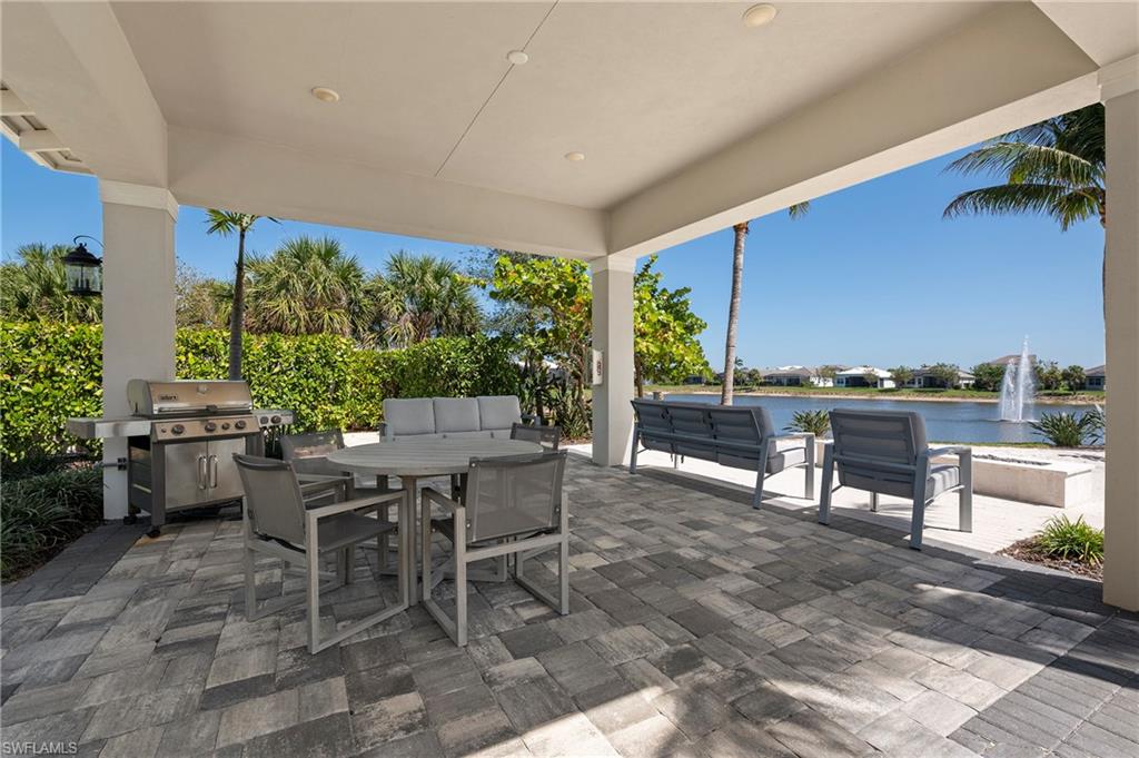 8897 Redonda Drive Naples, FL 34114 - Photo 33 of 42 a view of a dining table and chairs in the patio