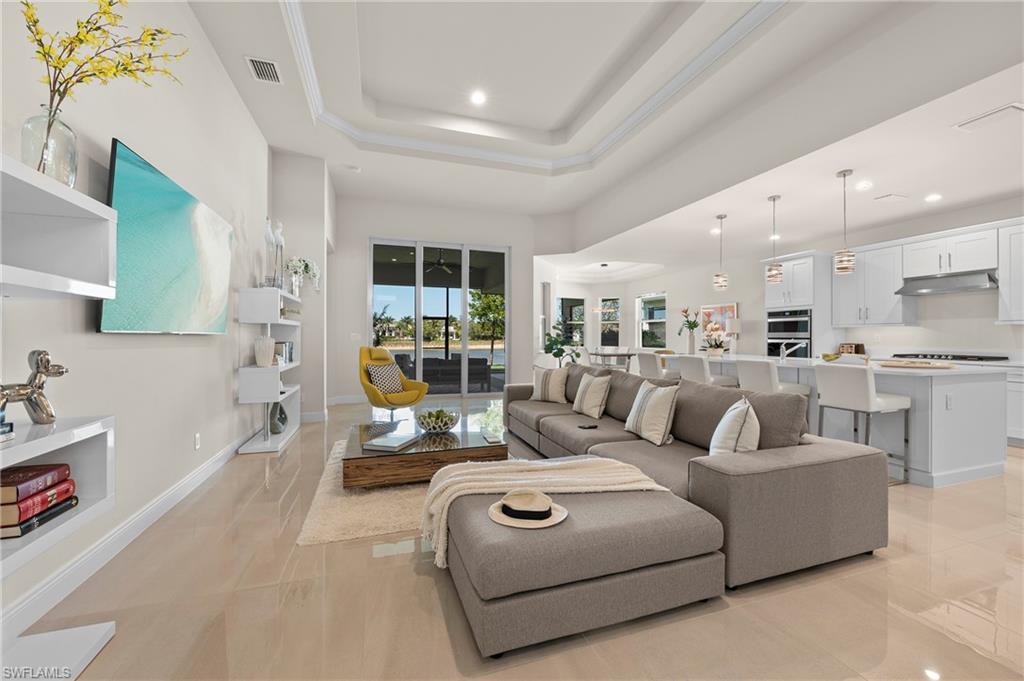 8897 Redonda Drive Naples, FL 34114 - Photo 5 of 42 a living room with furniture and a large window