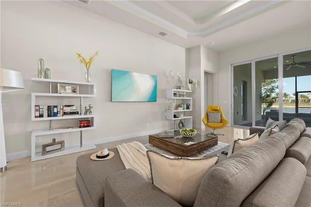 a living room with furniture and kitchen view